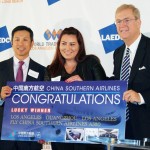 Louis Weixi Lu of China Southern Airlines gives away a roundtrip business-class ticket to one of the attendees.