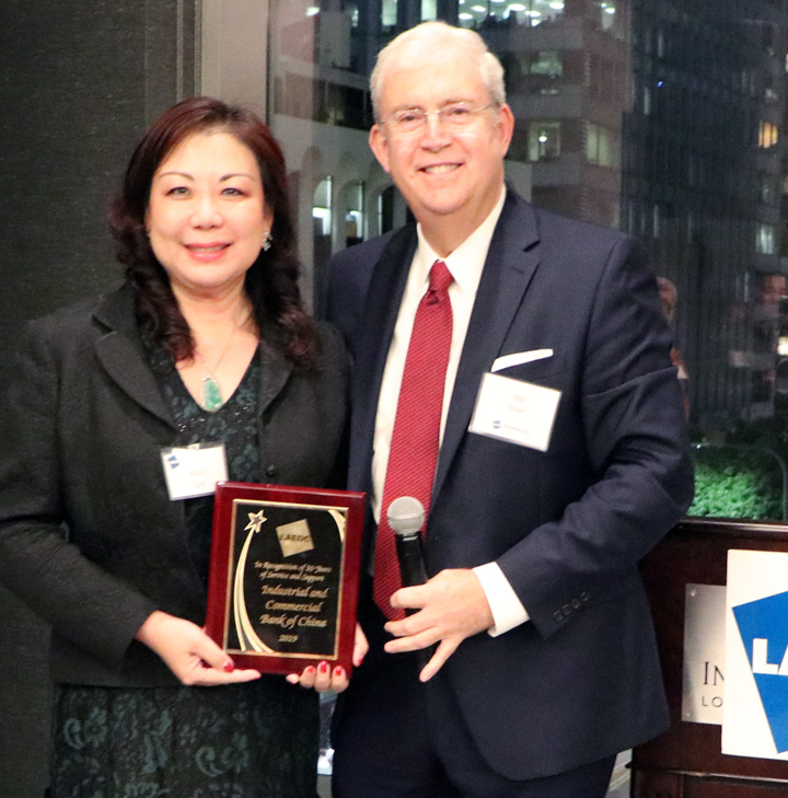 Alice Gao accepts recognition for ICBC's years of membership at LAEDC